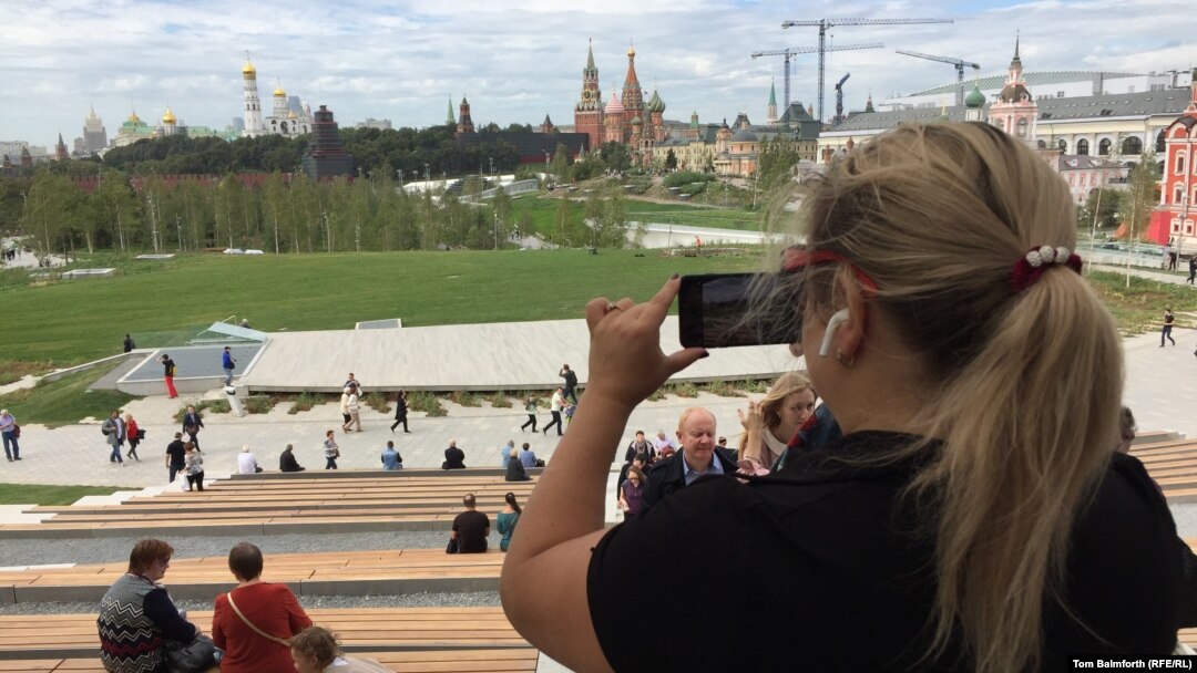 A visitor takes a photo of the view of Moscow's skyline from the new Zaryadye Park on September 15. 