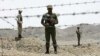 Iranian soldiers guard the border with Afghanistan and Pakistan in Iran's Sistan-Baluchistan Province. Security forces frequently clash with drug traffickers in the province. (file photo)