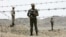 Iranian soldiers guard the border with Afghanistan and Pakistan in Iran's Sistan-Baluchistan Province. Security forces frequently clash with drug traffickers in the province. (file photo)