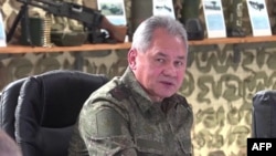 A video grab from handout footage released by the Russian Defense Ministry's press service on October 25 shows Russian Defense Minister Sergei Shoigu visiting the "Vostok" command post in eastern Ukraine.