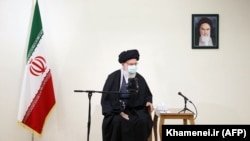 IRAN -- Iranian Supreme Leader Ayatollah Ali Khamenei meets with the family (unseen) of assassinated nuclear scientist Mohsen Fakhrizadeh in Tehran, January 25, 2021