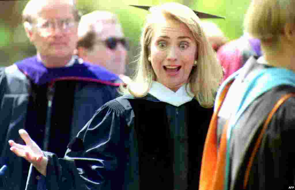 Clinton greets friends at an academic procession before the 1992 graduation ceremony at Wellesley College, where she was the keynote speaker. Clinton had been the president of the student government at Wellesley before earning her law degree from Yale Law School in 1973.