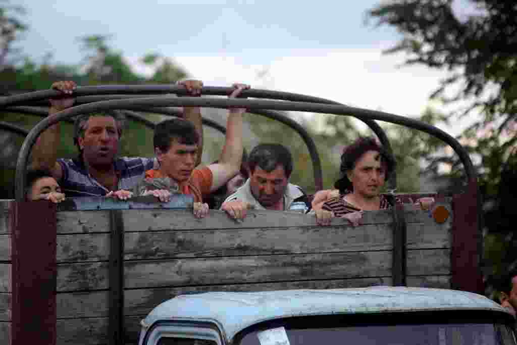 Ethnic Georgians from the villages surrounding Tskhinvali flee the conflict zone on August 8.