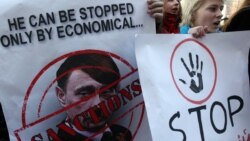 Вот такой плакат. Протест в Киеве у посольства Германии, 11 марта