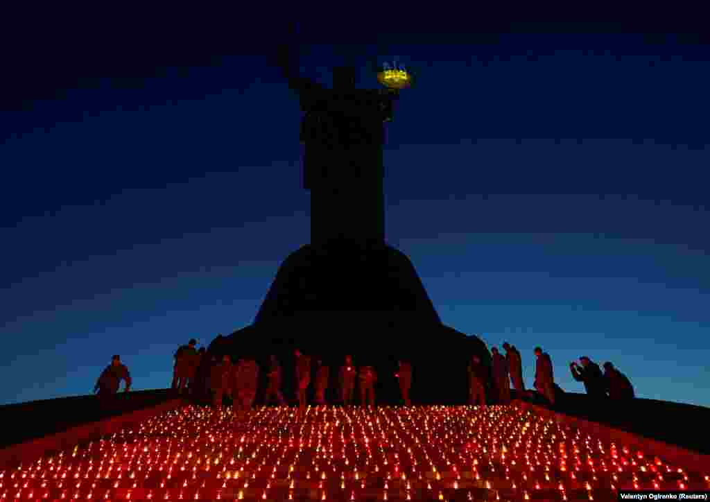 Ukrainian military cadets light candles during a commemorative ceremony on the 1,000th day of Russia&#39;s full-scale attack on their country on November 19, near the Motherland monument in Kyiv.&nbsp;