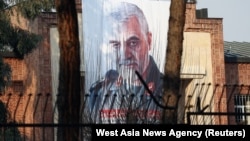 A picture of Qassem Soleimani, head of the elite Qods Force, who was killed in an air strike, is seen on the former U.S. Embassy's building in Tehran, January 7, 2020