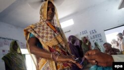 Women cast their votes at a polling station in Uttar Pradesh.