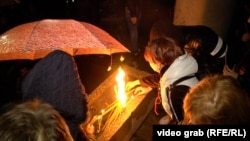 Lighting candles for Oliver Ivanovic in downtown Belgrade on October 12.
