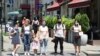 Armenia -- Pedestrians wear face masks in downtown Yerevan, July 10, 2020.