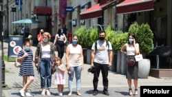 Armenia -- Pedestrians wear face masks in downtown Yerevan, July 10, 2020.