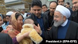 Iranian President Hassan Rohani visits flood-affected villages around the city of Aq-Qala in Golestan province, March 27, 2019