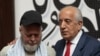 US citizen Dennis Coyle (left), upon his release by the Taliban, addresses the media with US former special envoy to Afghanistan Zalmay Khalilzad at the airport in Kabul on March 24.