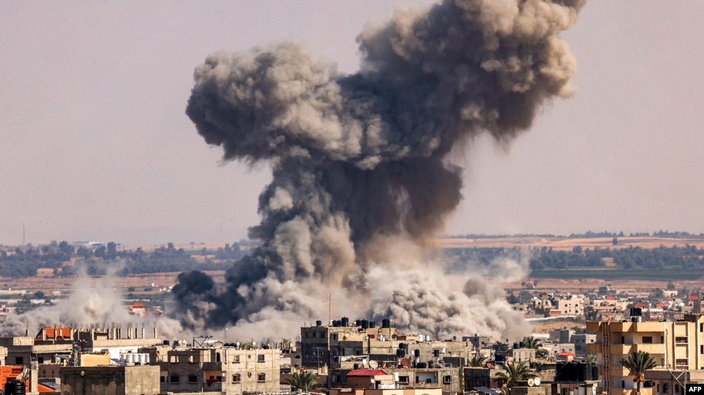 Smoke rises above Rafah during an Israeli bombardment of the southern Gaza Strip on October 19.