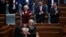Kosovo's new President Justina Pula receives a bouquet of flowers after being elected in an extraordinary parliamentary session in Pristina.