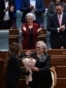 Newly elected as President of Kosovo Justina Pula receives a bouquet of flowers during an extraordinary session in Pristina on October 7, 2026.