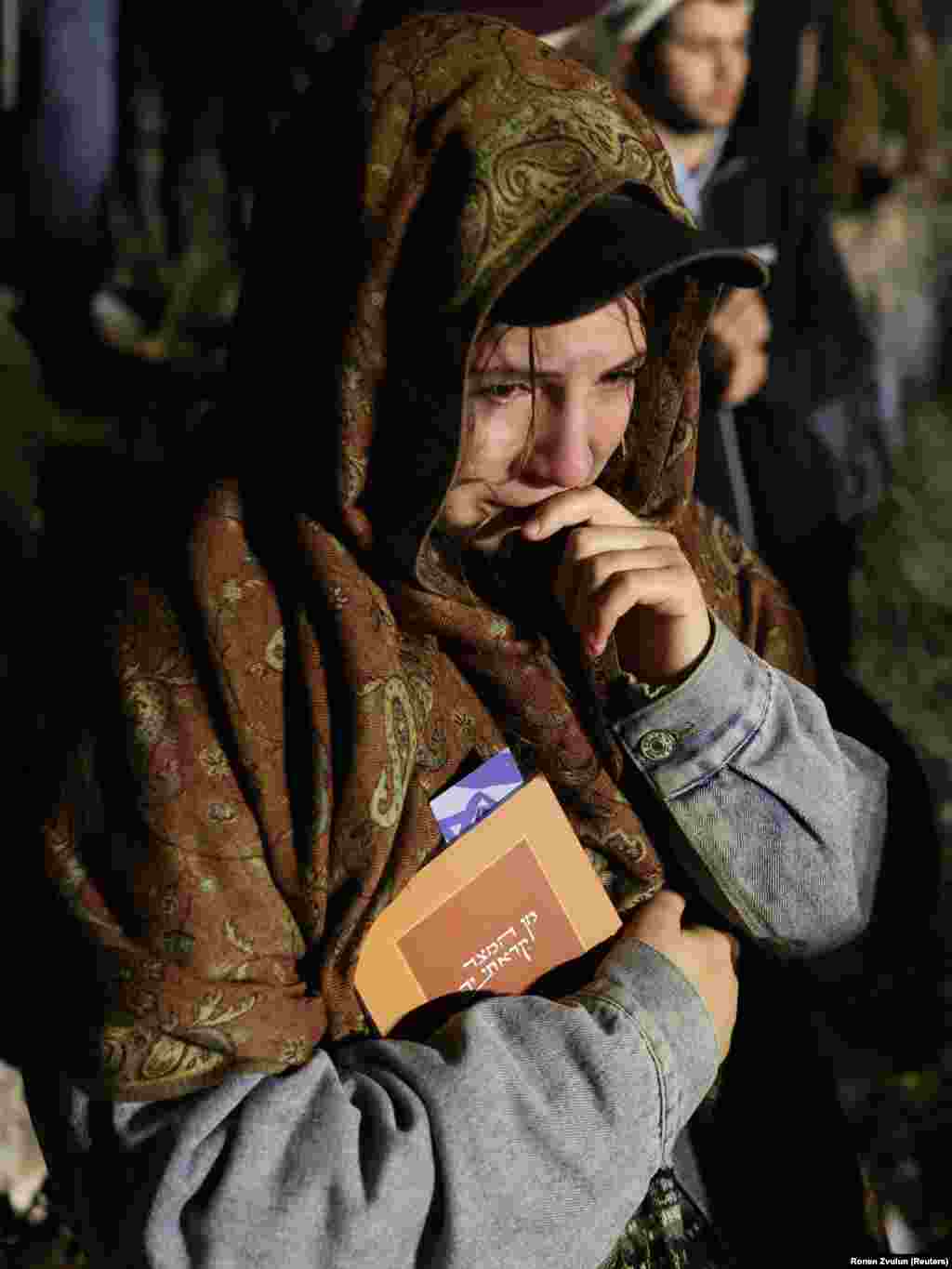 A woman mourns in Jerusalem during the March 29 funeral of Israeli-American citizen Moshe Yitzchak Hacohen Katz. The 22-year-old sergeant in the Israeli military was killed in combat in Lebanon.
