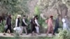 Newly freed Taliban prisoners walk out of Pul-e Charkhi prison in Kabul on August 13.