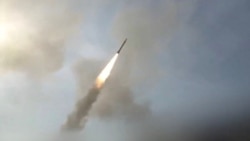 State TV video shows an Iranian missile flying through the air at an unknown location and to an unknown target.