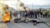 Kazakhstan - To defend against police forces Shanyraq residents built barricades from stones and old tires, Shanyraq's events, 14Jul2006