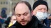 Vladimir Kara-Murza leaves flowers near the place where Boris Nemtsov was gunned down in Moscow on February 27, 2021.