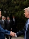 US President Donald Trump shakes hands with Chinese President Xi Jinping after a visit to the Zhongnanhai Garden in Beijing on May 15, 2026.