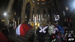 The coffin of former Czech President Vaclav Havel is displayed at St. Vitus Cathedral before the start of his funeral Mass in Prague on December 23.