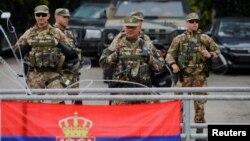 Italian members of the NATO-led Kosovo Force stand guard in Leposavic, northern Kosovo, on June 1.
