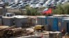 Russia -- Workers gather at a construction site near cars, produced by foreign automobile-makers, which are seen at a parking of a dealership in the background, on the outskirts of Moscow, August 18, 2014