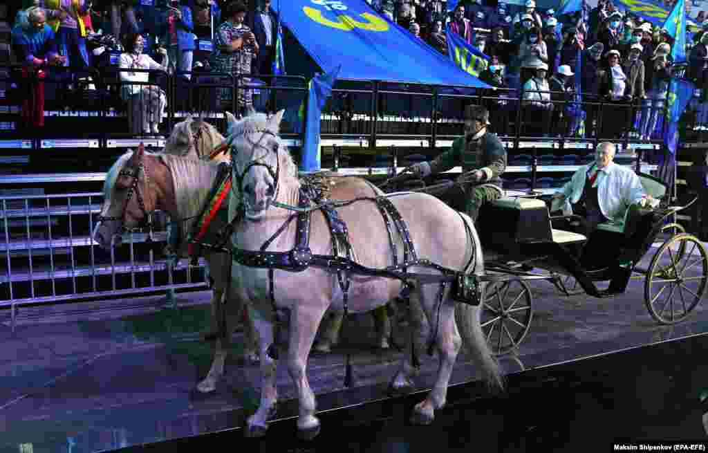 The leader of the Liberal Democratic Party of Russia, Vladimir Zhirinovsky, arrives on a troika, the traditional Russian carriage pulled by three horses, at the party convention in Moscow on September 13.