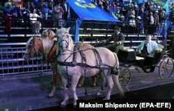 Zhirinovsky arrives on a troika, a traditional Russian carriage pulled by three horses, to the LDPR convention in Moscow on September 13, 2021.