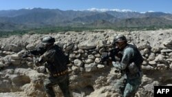 FILE: Afghan soldiers take part in an ongoing operation against the Islamic State (IS) militants in eastern Afghanistan.