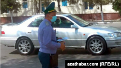 Turkmenistan. Policeman with face mask on the duty in Ashgabat. September 2021 