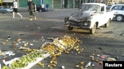 One of the attacks was a suicide bombing at a crowded market in the town of Sweida. 