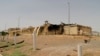 Photo released by the Atomic Energy Organization of Iran shows a building after it was damaged by a fire or explosion, at the Natanz enrichment facility.