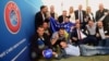 Delegation members from Kosovo celebrate their UEFA membership admission after the UEFA congress in Budapest on May 3.