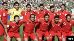 Rahman Rezaei (third right at back) poses with Iran's national soccer team in 2006.