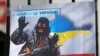 Плакат із зображенням президента Росії Володимира Путіна під час акції «Крим – це Україна» біля російського посольства в Києві, 16 березня 2020 року