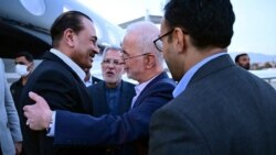 Pakistani Army Chief Syed Asim Munir (left) is greeted by Iranian Interior Minister Eskandar Momeni upon his arrival in Tehran on May 22.