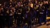 Georgian security personnel in Tbilisi drag down a protester on February 2.