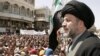 Shi'ite cleric Hazim al-Araji, an aide to Shi'ite cleric Muqtada al-Sadr, addresses a demonstration 