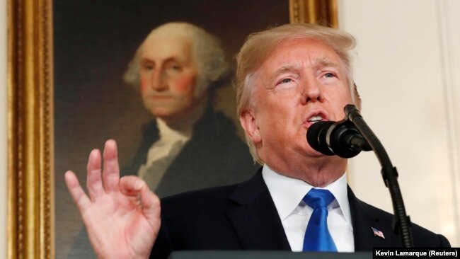 U.S. President Donald Trump speaks about Iran and the Iran nuclear deal in front of a portrait of President George Washington in the Diplomatic Room of the White House in Washington, D.C., October 13, 2017.