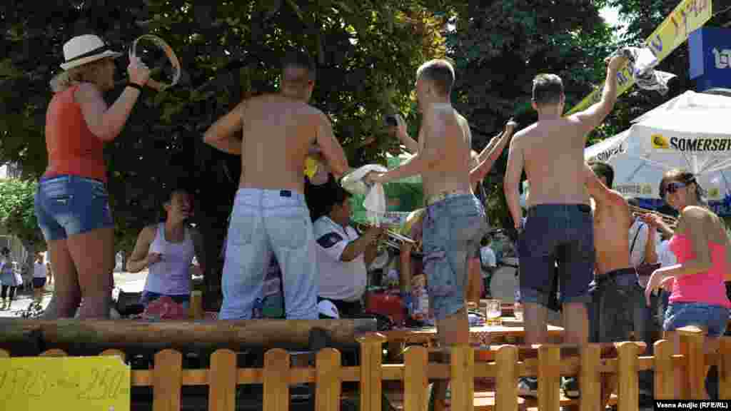 Visitors dance to the music of a brass band at a local restaurant.