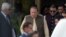 Pakistani Prime Minister Nawaz Sharif (C) leaves with his son Hussain Nawaz (2R) after appearing before an anti-corruption commission at the Federal Judicial Academy in Islamabad on June 15