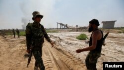 Fighters from Iraqi Shiite group Kataib Sayyid al-Shuhada gather near Falluja, Iraq, May 23, 2016