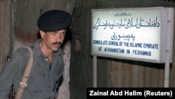 A Pakistani policeman stands guard outside the Afghan Consulate in Peshawar.