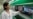 Kyrgyzstan -- A Kyrgyz specialist with a mockup of the domestically produced satellite. 