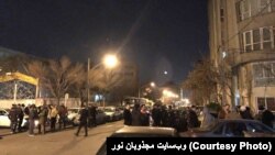 Gonabadi dervishes in Pasdaran Avenue, around the house of their leader.