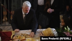 Prime Minister-designate Krivokapic pays his respect to the late Archbishop Amfilohije in Podgorica on November 1.