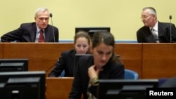 Jovica Stanisic (top left), former chief of Serbian State Security, and Franko Simatovic (top right), former commander of the Special Operations Unit of the Serbian State Security Service, sit in the courtroom in The Hague on May 30, when they were acquitted.