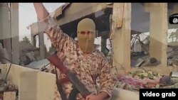 A screen-grab from a video released by the militant group Islamic State (IS), which contains a rare message in Persian saying the extremists will conquer Iran.